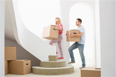 simsearch:693-07912629,k - Couple carrying cardboard boxes up stairs in new house Stock Photo - Premium Royalty-Free, Code: 693-07912568