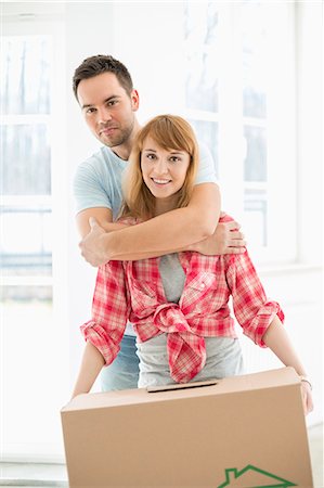 simsearch:693-07912629,k - Portrait of man embracing woman in new house Stock Photo - Premium Royalty-Free, Code: 693-07912570