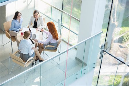 document - High angle view of businesswomen discussing at table in office Stock Photo - Premium Royalty-Free, Code: 693-07912736