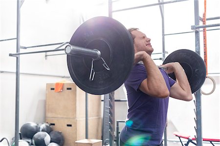 simsearch:693-08126938,k - Confident man lifting barbell in crossfit gym Stock Photo - Premium Royalty-Free, Code: 693-08126941
