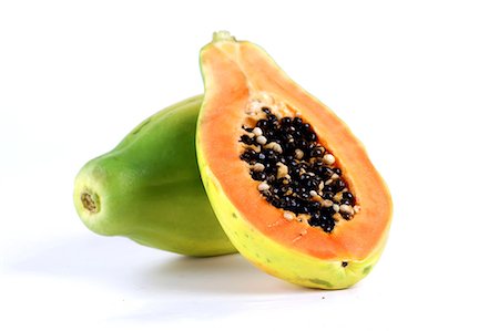 pulp - Halved papaya on white background Stock Photo - Premium Royalty-Free, Code: 693-08127376