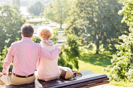 sitting back - Back view of middle-aged couple relaxing on park bench Stock Photo - Premium Royalty-Free, Code: 693-08127653