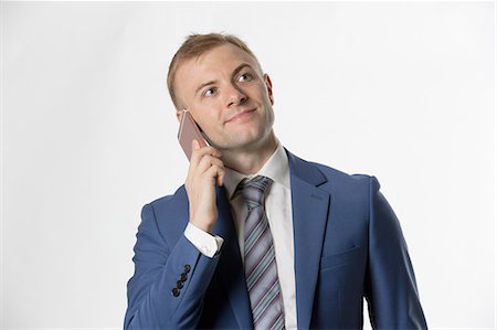 simsearch:859-06710917,k - Businessman making call on cellphone Stock Photo - Premium Royalty-Free, Code: 693-08769602