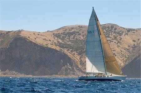simsearch:693-03314237,k - Sailboat by coastline on ocean Stock Photo - Premium Royalty-Free, Code: 693-03299368