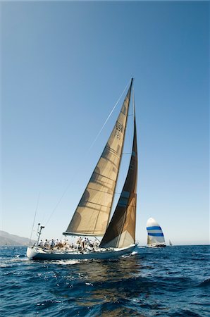 simsearch:693-03314237,k - Sailboat in Race on ocean, back view Stock Photo - Premium Royalty-Free, Code: 693-03299370