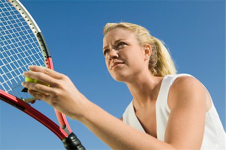 simsearch:640-06050635,k - Female Tennis Player Preparing to Serve, low angle view, close up Stock Photo - Premium Royalty-Free, Code: 693-03299493
