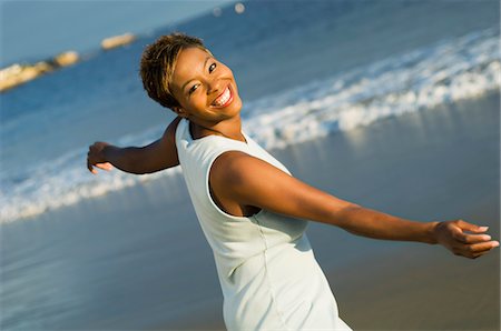 Woman dancing on beach, (portrait) Stock Photo - Premium Royalty-Free, Code: 693-03299737
