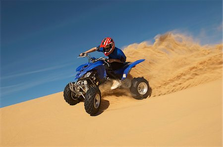 dune driving - Man riding quad bike in desert Stock Photo - Premium Royalty-Free, Code: 693-03299906