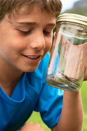 snake images for kids - Boy Looking at Snake in Jar Stock Photo - Premium Royalty-Free, Code: 693-03304326