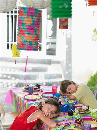 simsearch:693-03305634,k - Boy and girl (7-9) sleeping at table after birthday party Stock Photo - Premium Royalty-Free, Code: 693-03305584