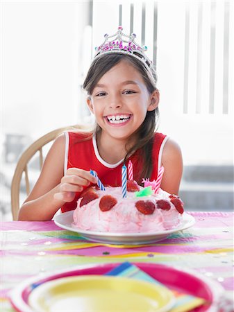 simsearch:693-03305634,k - Portrait of girl (7-9) with birthday cake, laughing Stock Photo - Premium Royalty-Free, Code: 693-03305594