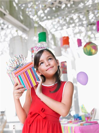 simsearch:693-03305634,k - Portrait of girl (7-9) holding birthday present at party Stock Photo - Premium Royalty-Free, Code: 693-03305600