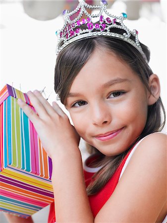 simsearch:693-03305634,k - Portrait of young girl (7-9) with birthday present, close-up Stock Photo - Premium Royalty-Free, Code: 693-03305602