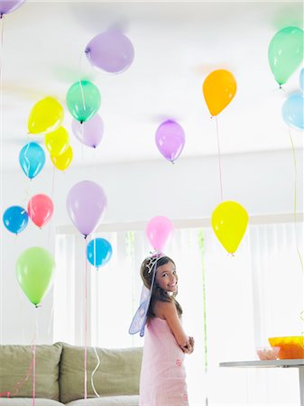 simsearch:693-03305634,k - Young girl (7-9) standing in room full of balloons Stock Photo - Premium Royalty-Free, Code: 693-03305642