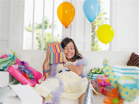 simsearch:693-03305634,k - Young girl (7-9) opening birthday presents Stock Photo - Premium Royalty-Free, Code: 693-03305660
