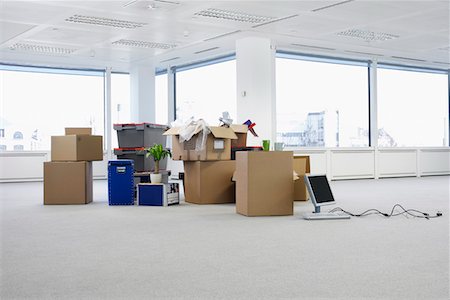 Cartons and equipment on floor of empty office space Stock Photo - Premium Royalty-Free, Code: 693-03306031