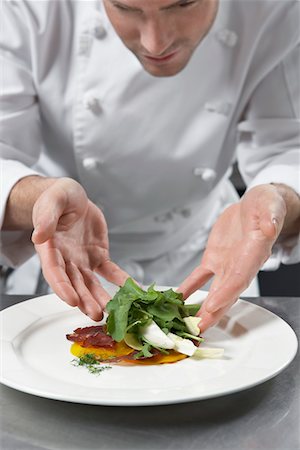 Male chef preparing salad in kitchen Stock Photo - Premium Royalty-Free, Code: 693-03308925