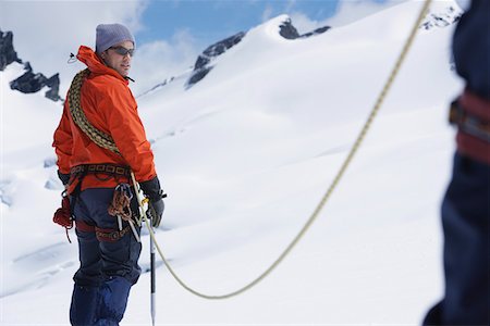 Hikers joined by safety line in snowy mountains Stock Photo - Premium Royalty-Free, Code: 693-03300928