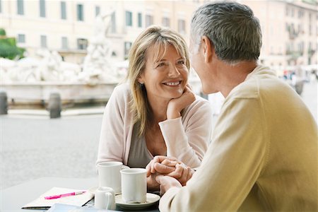 Middle-aged couple sitting at outdoor cafe in Rome, close up Stock Photo - Premium Royalty-Free, Code: 693-03301680