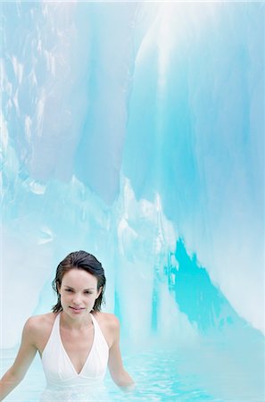 swimsuits not on people - Woman standing in pool of water in ice crevice, portrait Stock Photo - Premium Royalty-Free, Code: 693-03301886