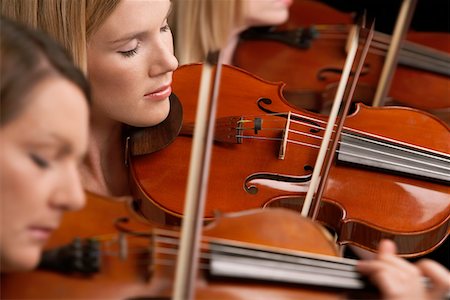 Women Playing Violins in musical group, close-up Stock Photo - Premium Royalty-Free, Code: 693-03302064