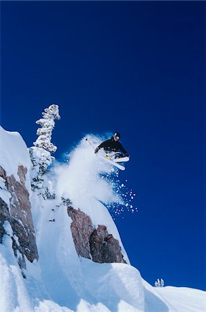 extreme skiing cliff - Skier jumping from mountain ledge Stock Photo - Premium Royalty-Free, Code: 693-03302490
