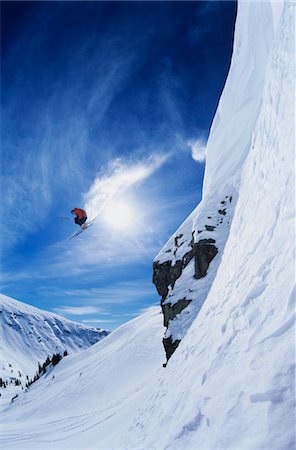 extreme skiing cliff - Skier jumping from mountain ledge Stock Photo - Premium Royalty-Free, Code: 693-03302491