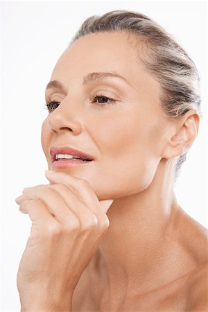 Middle-Aged Woman, hand on chin Stock Photo - Premium Royalty-Free, Code: 693-03302816