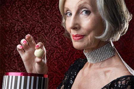 Wealthy Senior Woman with box of candy Stock Photo - Premium Royalty-Free, Code: 693-03302935