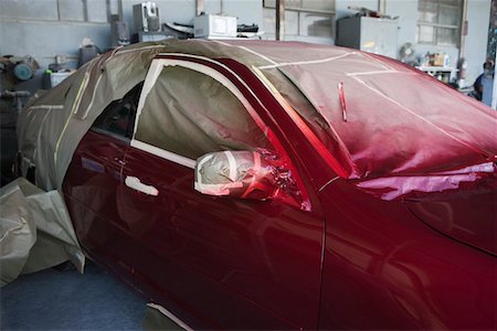 Red painted car in garage Stock Photo - Premium Royalty-Free, Code: 693-03314483