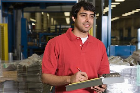 polo shirt - Man working in newspaper factory Stock Photo - Premium Royalty-Free, Code: 693-03315447