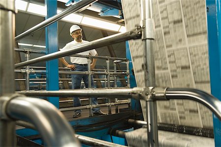 printing press - Man working in newspaper factory Stock Photo - Premium Royalty-Free, Code: 693-03315566