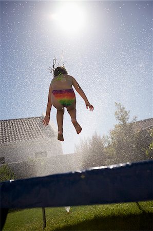 South Africa, Cape Town, girl jumping on trampoline Stock Photo - Premium Royalty-Free, Code: 693-03316552