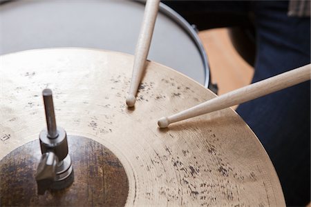 rhythm - Drumsticks on metal cymbal Stock Photo - Premium Royalty-Free, Code: 693-03317270