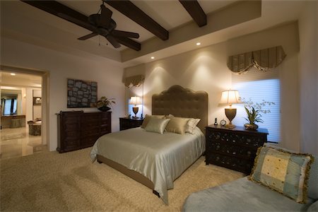 exposed beam ceiling - Silk bed cover on double bed in Palm Spring bedroom with beamed ceiling Stock Photo - Premium Royalty-Free, Code: 693-03317368