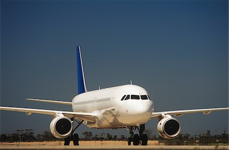 Passenger jet on taxiway Stock Photo - Premium Royalty-Free, Code: 693-03310524