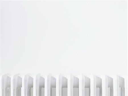 radiator - Close up of radiator against white wall Stock Photo - Premium Royalty-Free, Code: 693-03310982