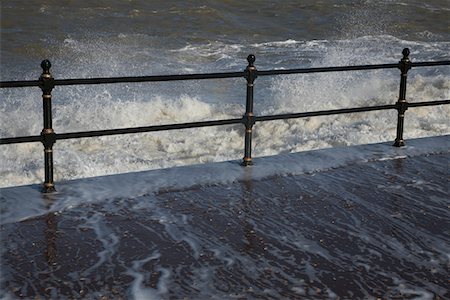 flood - Water crashing over rail Stock Photo - Premium Royalty-Free, Code: 693-03312005