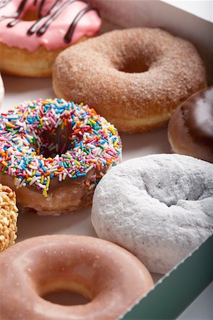 sprinkles - Variety of doughnuts in box Stock Photo - Premium Royalty-Free, Code: 693-03312117