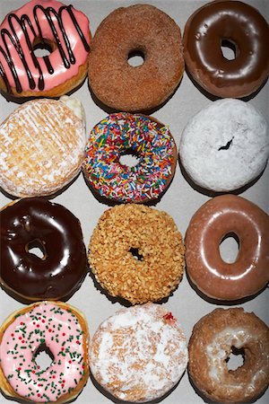 sprinkles - Variety of doughnuts in cardboard box, view from above Stock Photo - Premium Royalty-Free, Code: 693-03312132