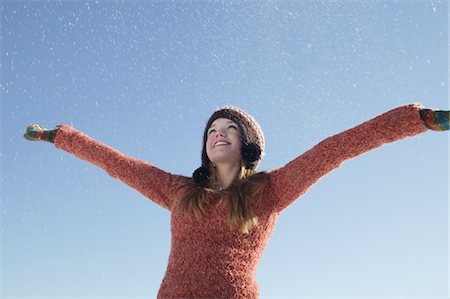 14 year old girl in winter clothing with arms outstretched Stock Photo - Premium Royalty-Free, Code: 693-03440925