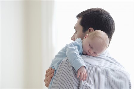 dad not mom child back - Father holds newborn on shoulder Stock Photo - Premium Royalty-Free, Code: 693-03474450