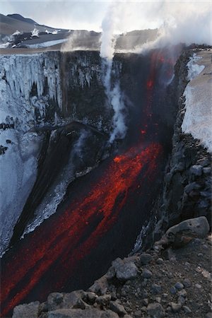 Molten lava and smoke of Eyjafjallajokull, Fimmvorduhals, Iceland Stock Photo - Premium Royalty-Free, Code: 693-03474620