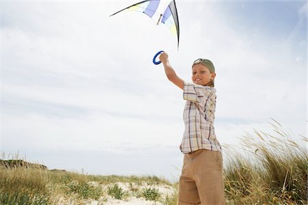 people flying a kite - Girl Flying Kite at Sand Dunes Stock Photo - Premium Royalty-Free, Code: 693-03564604