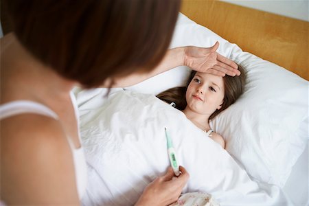 simsearch:632-03424324,k - Mother checking temperature of daughter in bed Stock Photo - Premium Royalty-Free, Code: 693-03564900