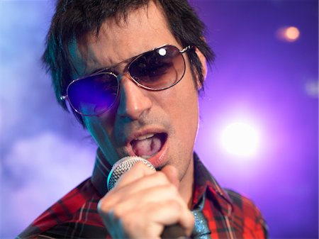 Rock Singer Performing on Stage Stock Photo - Premium Royalty-Free, Code: 693-03564981