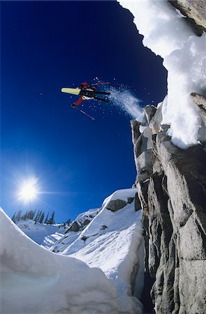 extreme skiing cliff - Skier jumping from cliff in mountains Stock Photo - Premium Royalty-Free, Code: 693-03565086