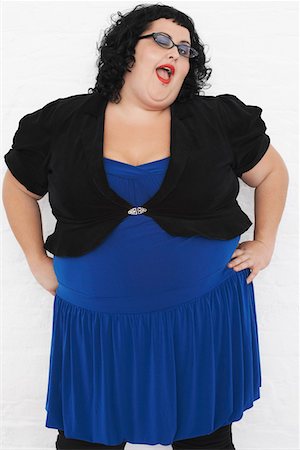 Overweight Woman Winking, portrait Stock Photo - Premium Royalty-Free, Code: 693-03565325