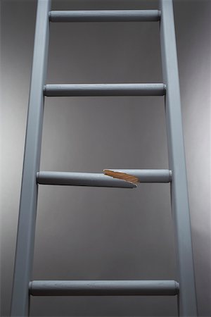 Ladder with one step broken Stock Photo - Premium Royalty-Free, Code: 693-03565835