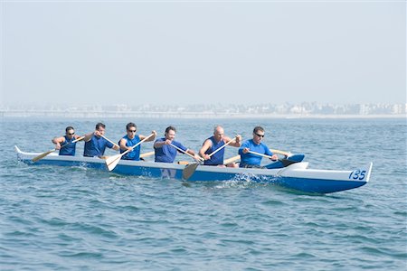 rowing team - Outrigger canoeing team on water Stock Photo - Premium Royalty-Free, Code: 693-03617066